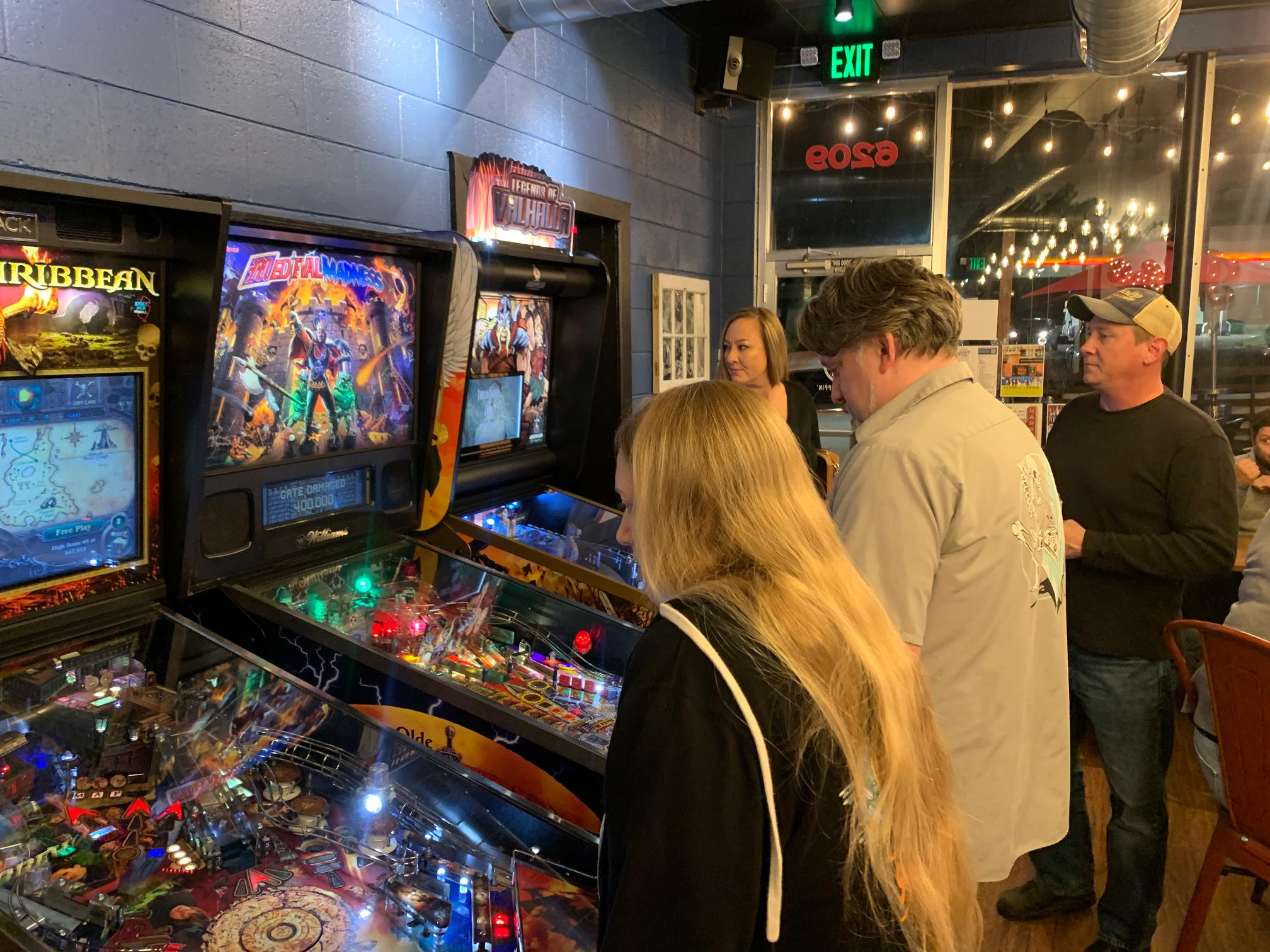 Nostalgic Arcade Bar Game Night with Classic Pinball Machines for a